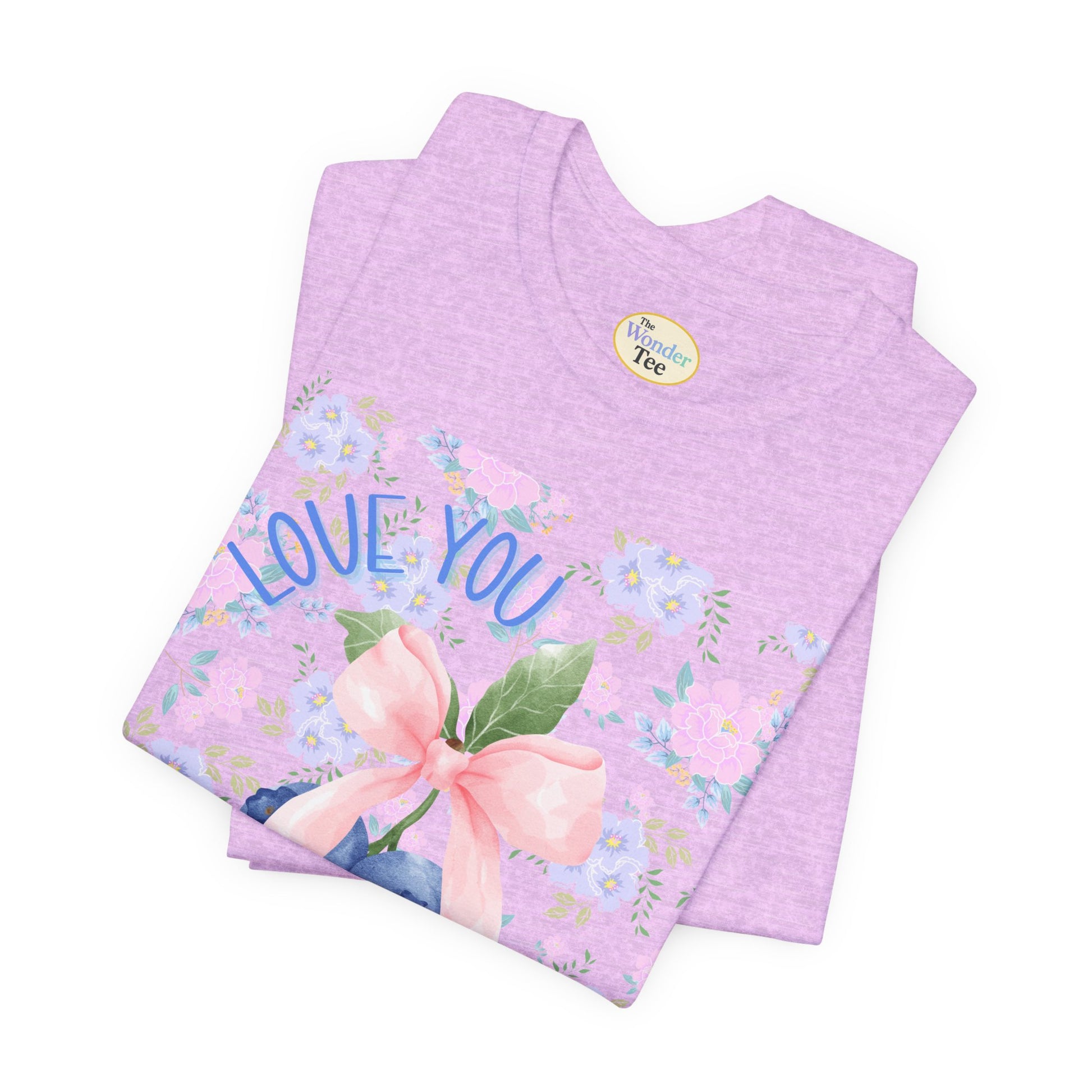 Folded purple fabric with floral design and 'Love You' text on a white background